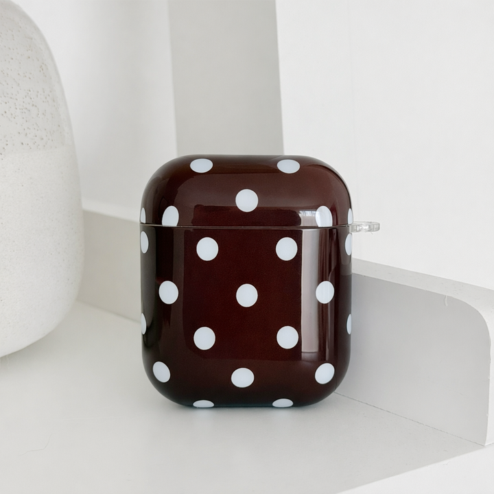 Brown AirPods Case with blue polka dot design.