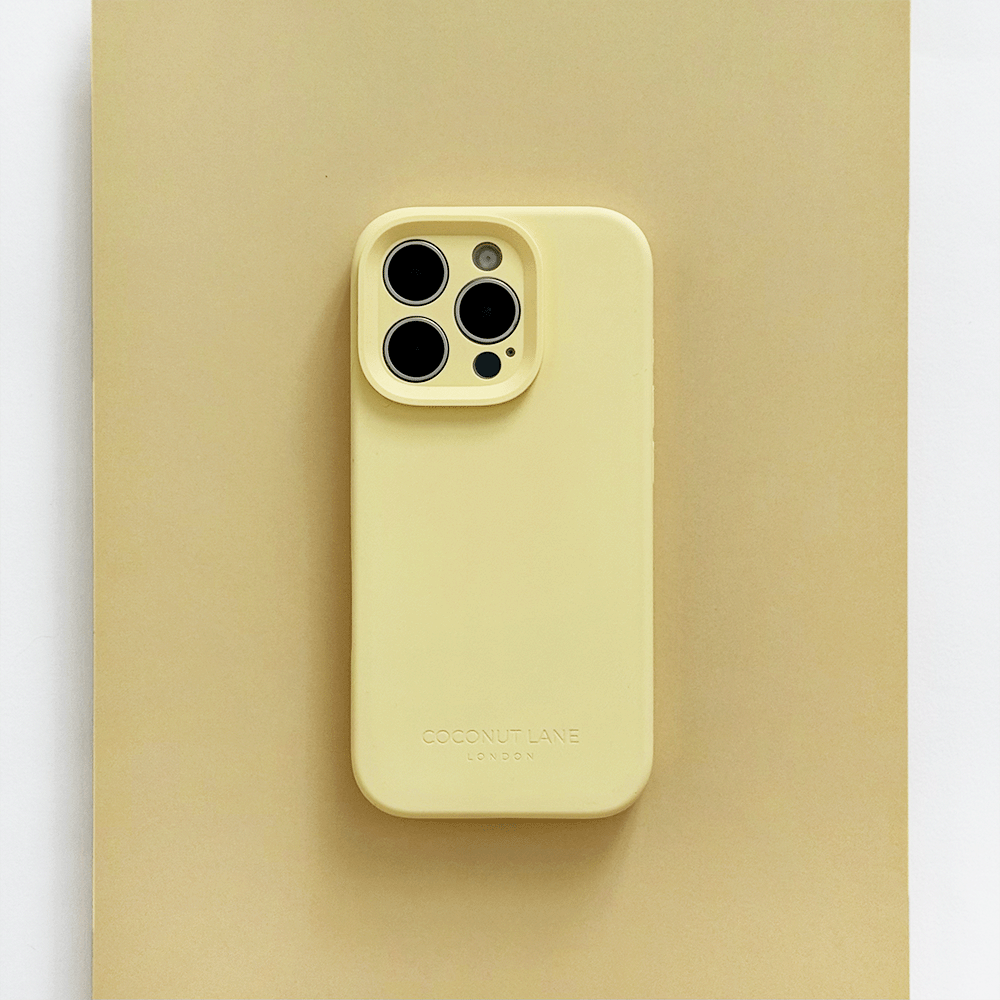 Yellow Phone Case with 'Coconut Lane' branding on a pink background.