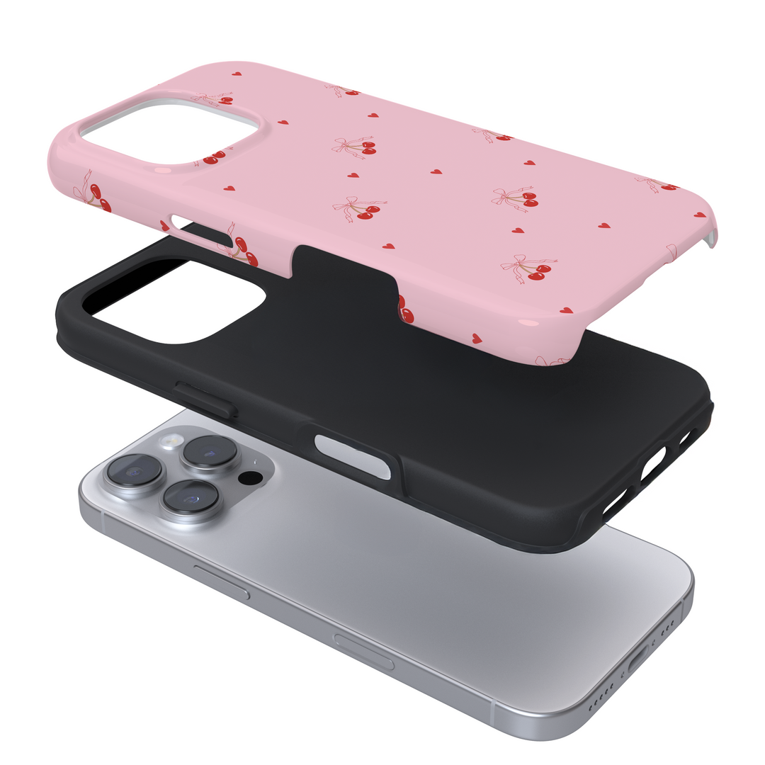 Expanded view of a pink phone case with a cherry pattern on a white background