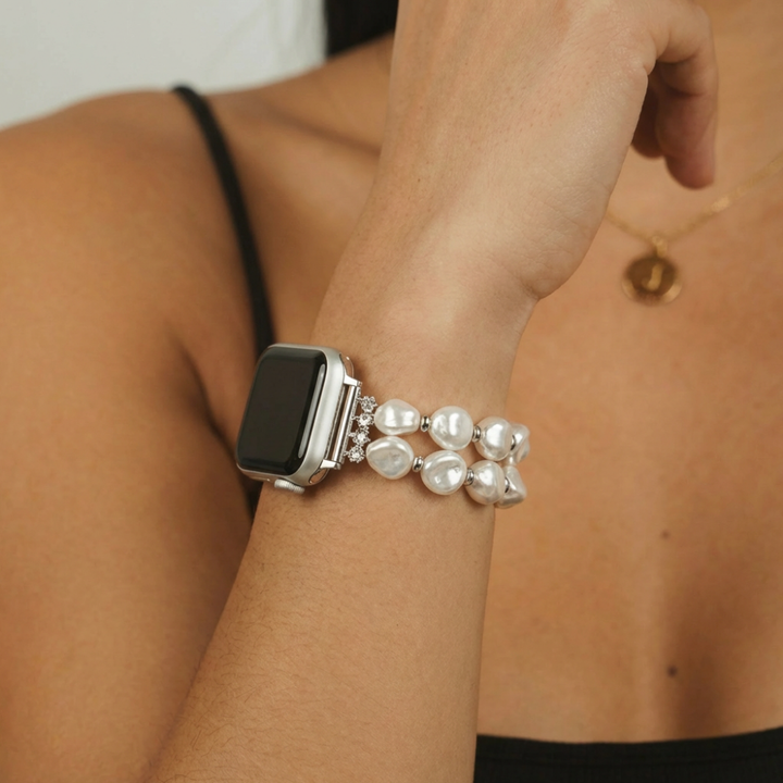 Coconut Lane chunky pearl Apple Watch strap worn with a black strappy top and a simple gold necklace.