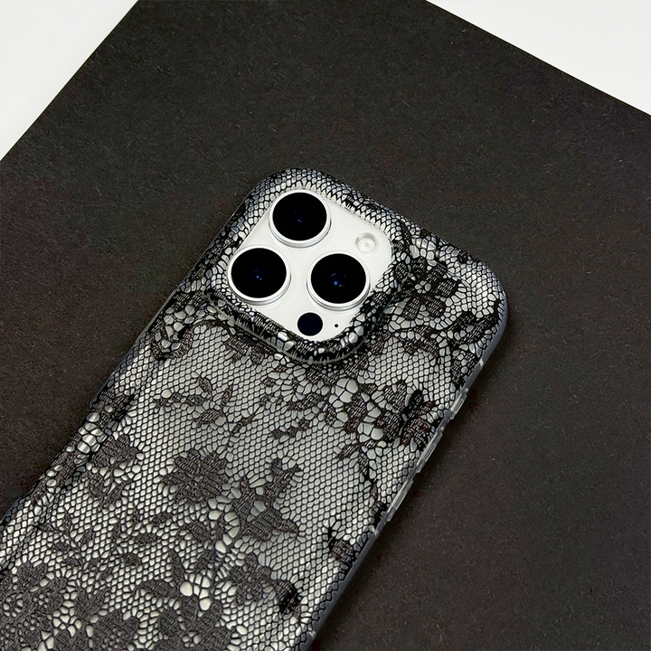 Clear Phone Case with lace design on a dark surface.