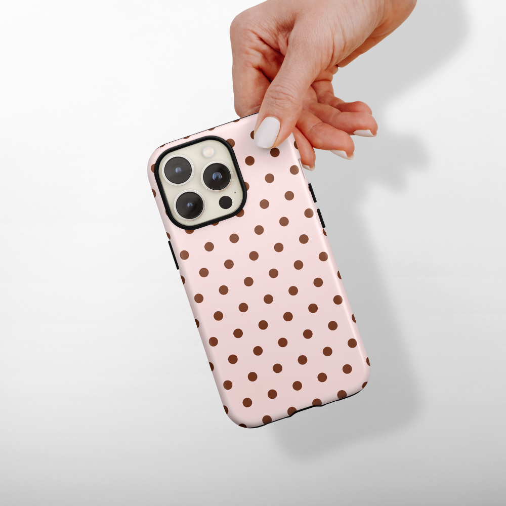 Baby pink phone case with chcolate brown polka dots.