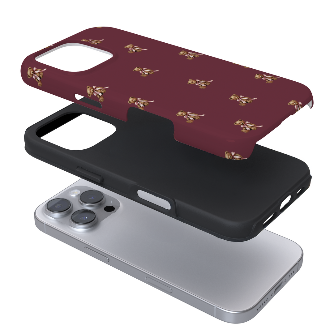 Expanded view of a burgundy phone case with a teddy pattern on a white background