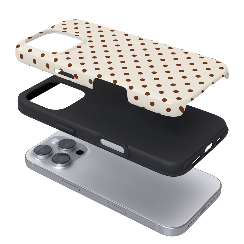 Brown polka dots on a cream background.