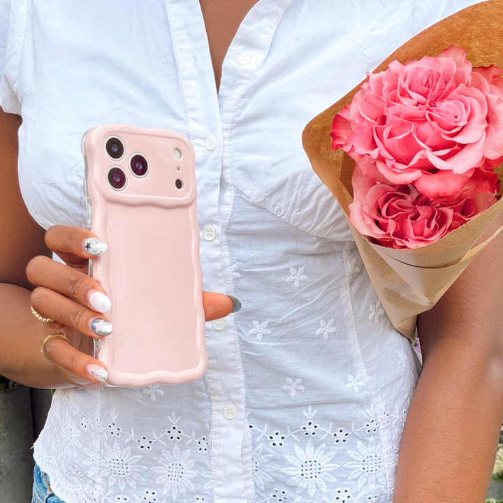 Girl holding flowers and wavy phone case in pink