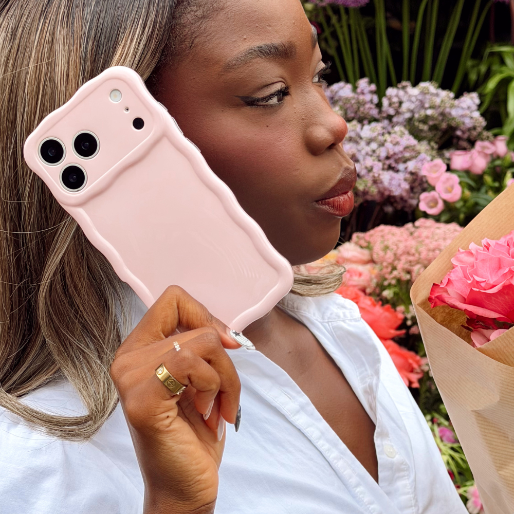 Girl on the phone with her phone case wavy phone case in pink